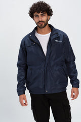 Men's navy blue waterproof jacket with a full zipper, stand collar, and multiple utility pockets.