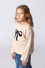 Girl's Long Sleeved Pullover With A Bow Print On The Front And A Round Neck