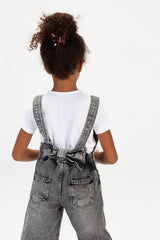 Girls Used Slouchy Jeans Jumpsuit With A Bow Tie At The Back And A Modern Cut