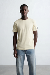 Men’s Ribbed Crew Neckline Tomato Store Signature Shoulder Patch Short Sleeves T-Shirt