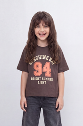 Girl's Tomato Store Sunshine Bay T-Shirt Collegiate Arch Typography Frames A Bold 94 Front Graphic With Bright Summer Slogan