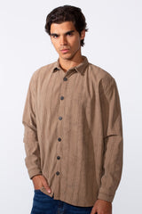 Men's slim fit long sleeve velvet shirt in tan with dark vertical wavy stripes.