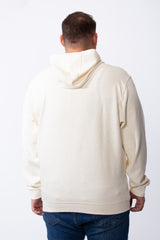 Rear view of a man wearing a cream-colored long sleeve big size hoodie with blue jeans.