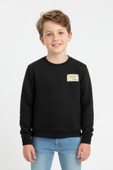 Boy's Oversized Sweatshirt With A Round Neck And Graphic Print On The Back