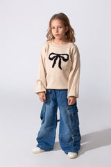 Girl's Long Sleeved Pullover With A Bow Print On The Front And A Round Neck