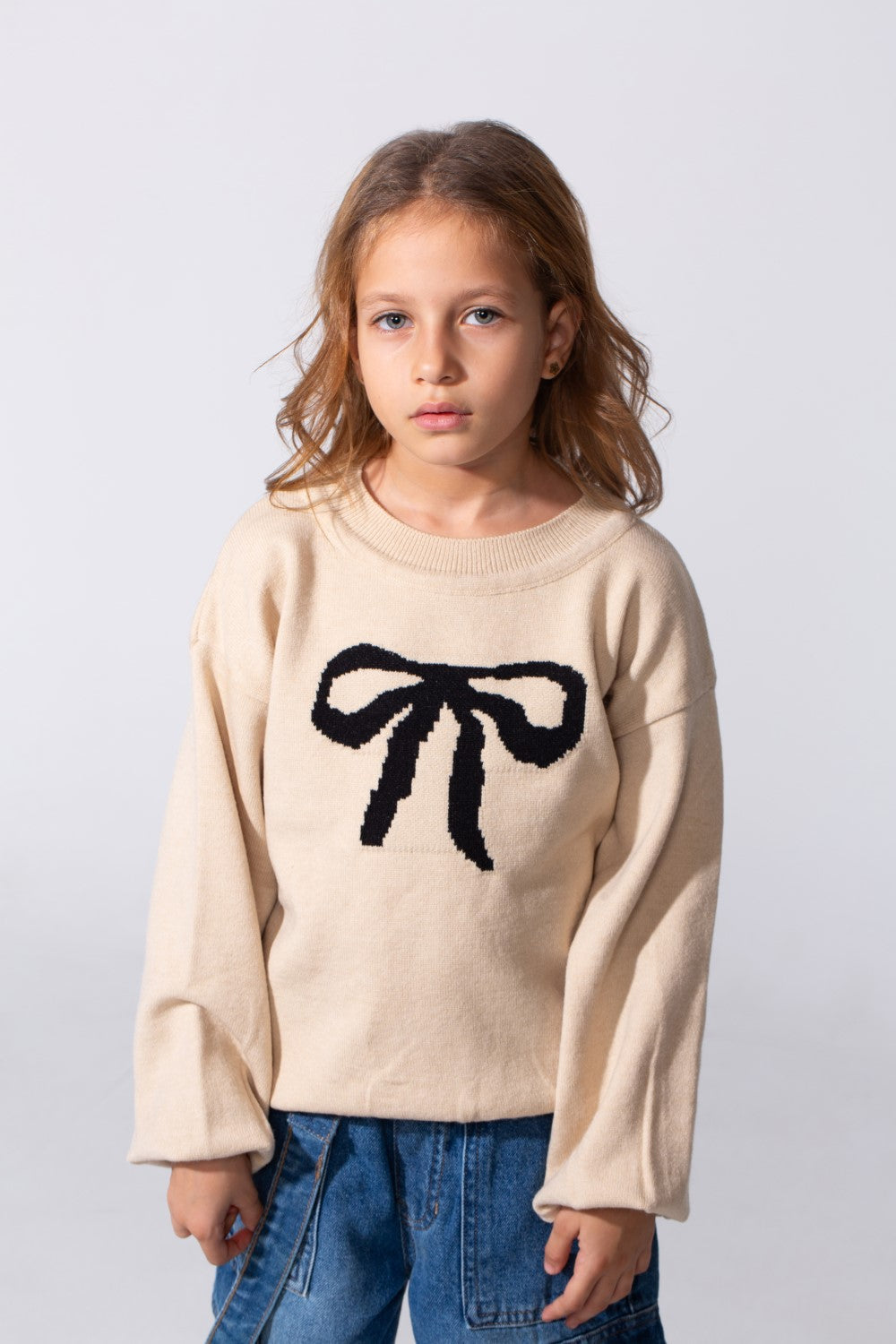 Girl's Long Sleeved Pullover With A Bow Print On The Front And A Round Neck