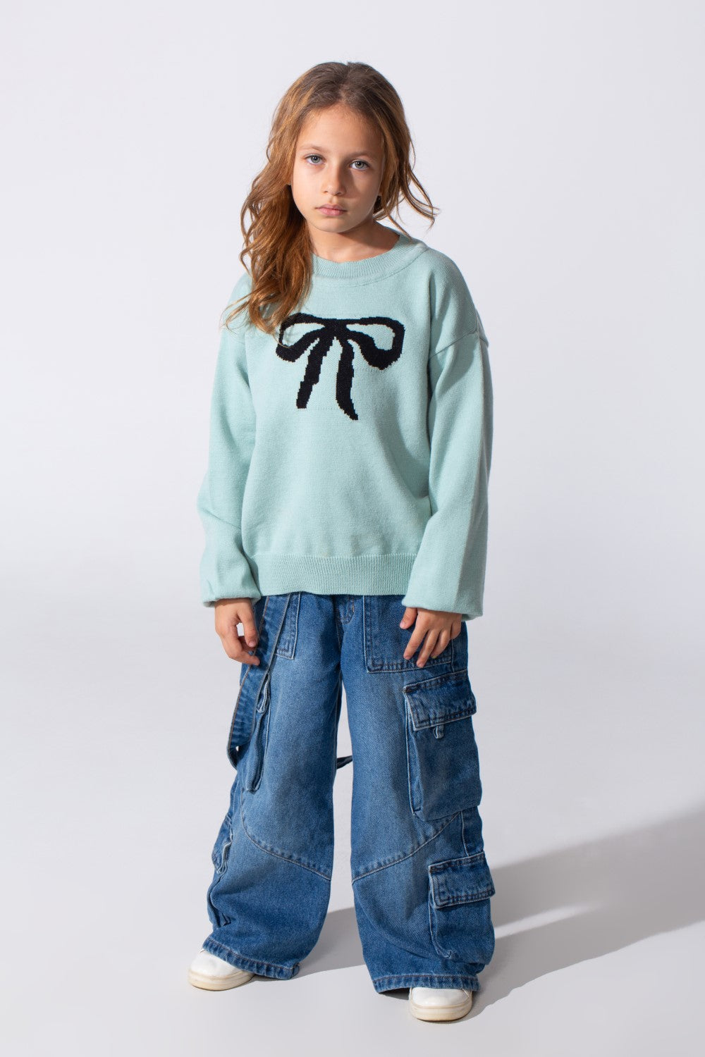 Girl's Long Sleeved Pullover With A Bow Print On The Front And A Round Neck