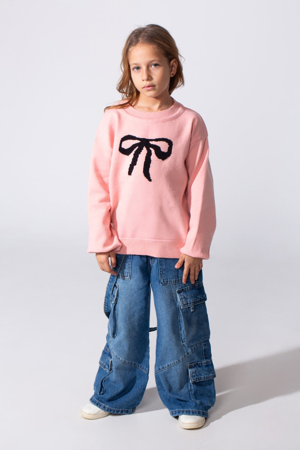 Girl's Long Sleeved Pullover With A Bow Print On The Front And A Round Neck