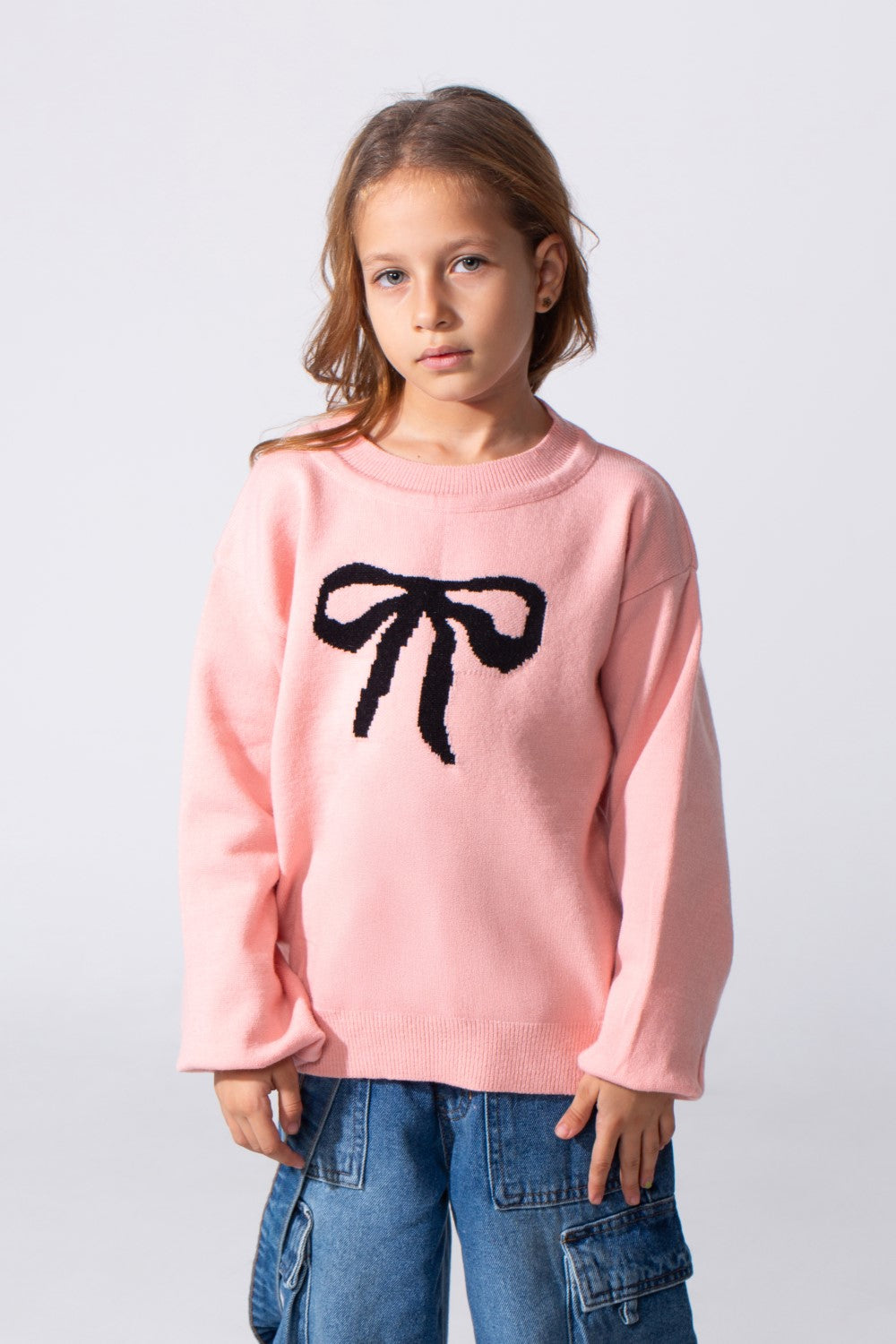 Girl's Long Sleeved Pullover With A Bow Print On The Front And A Round Neck