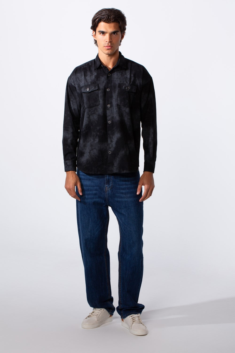 Men's regular fit washed black gabardine shirt with front pockets and blue jeans.