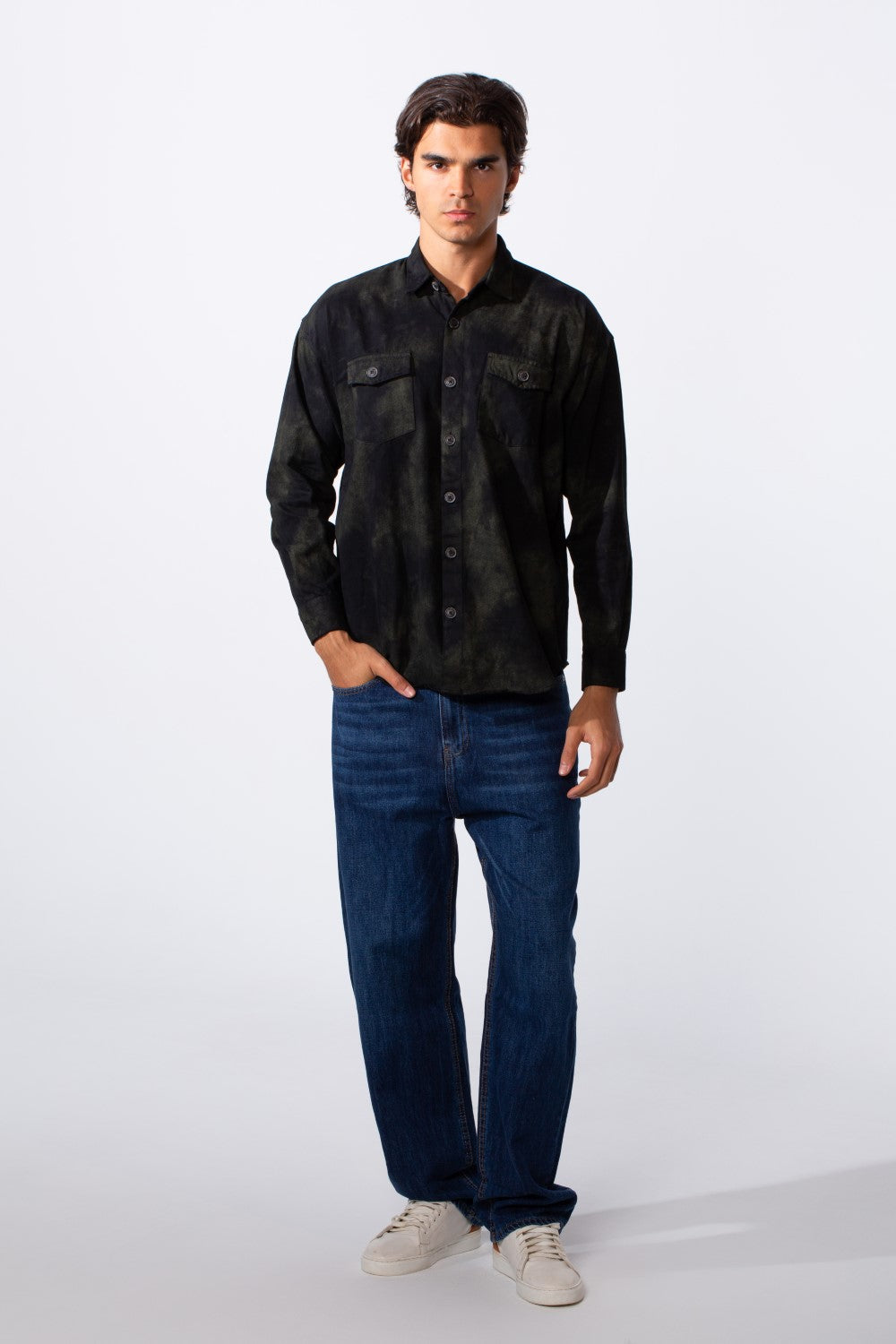 Men's regular fit washed gabardine shirt in dark olive with front pockets and blue jeans.