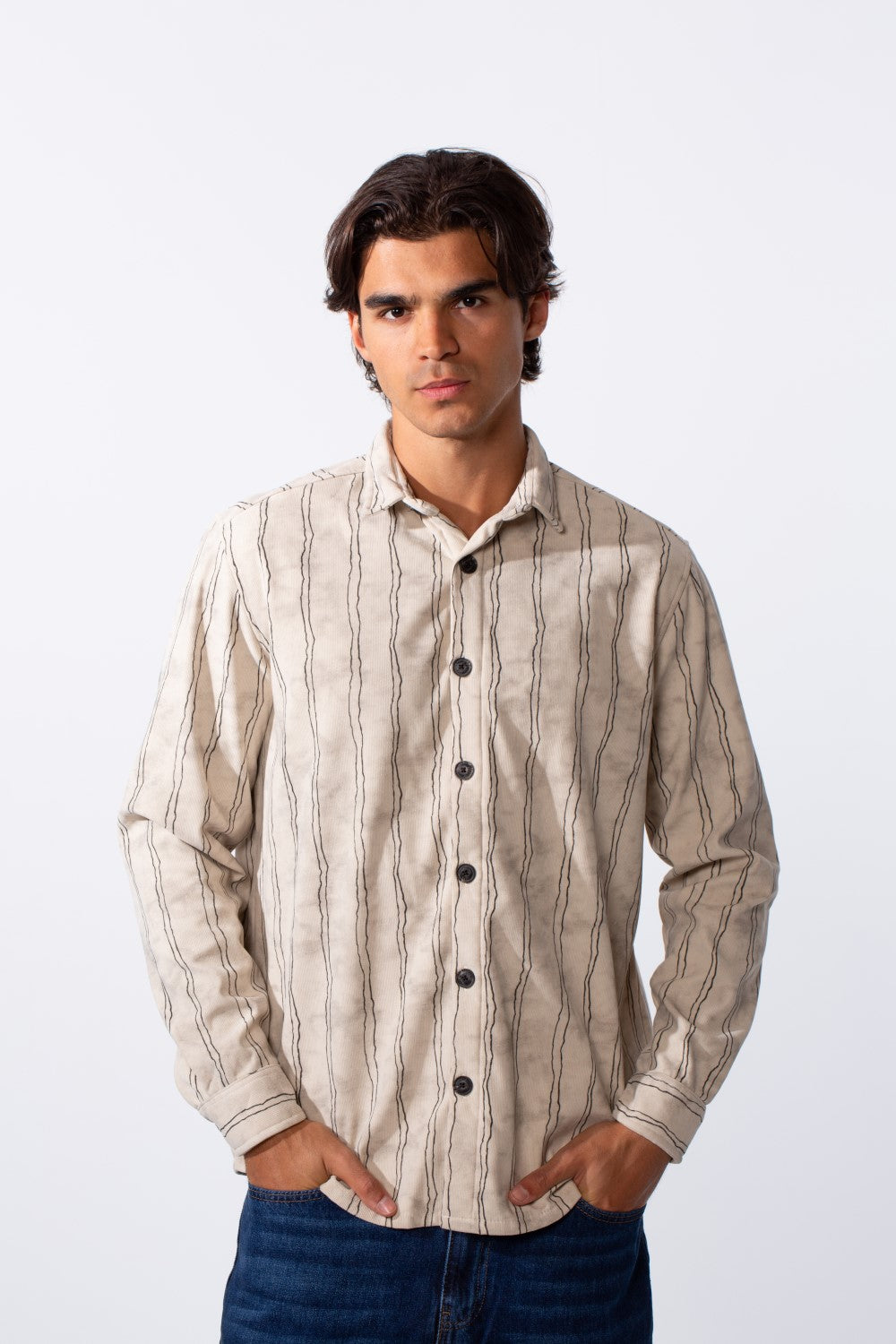 Men's slim-fit long-sleeve velvet shirt in beige with thin vertical black stripes.