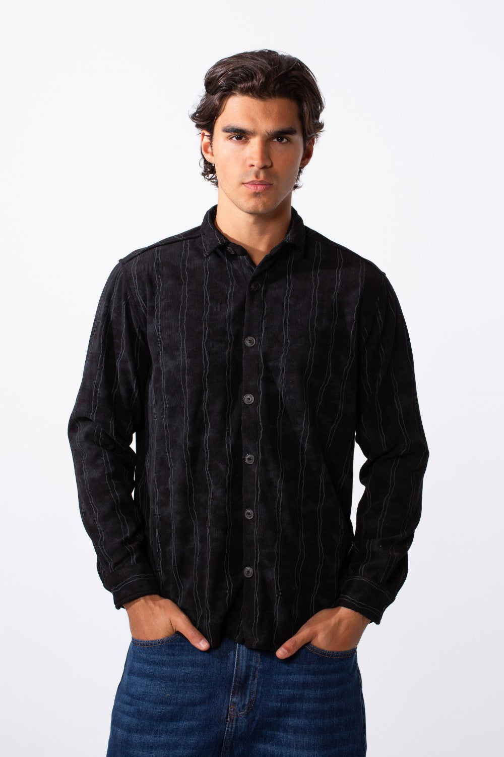 Men's slim fit long sleeve black velvet shirt with subtle vertical stripes and button-down front.