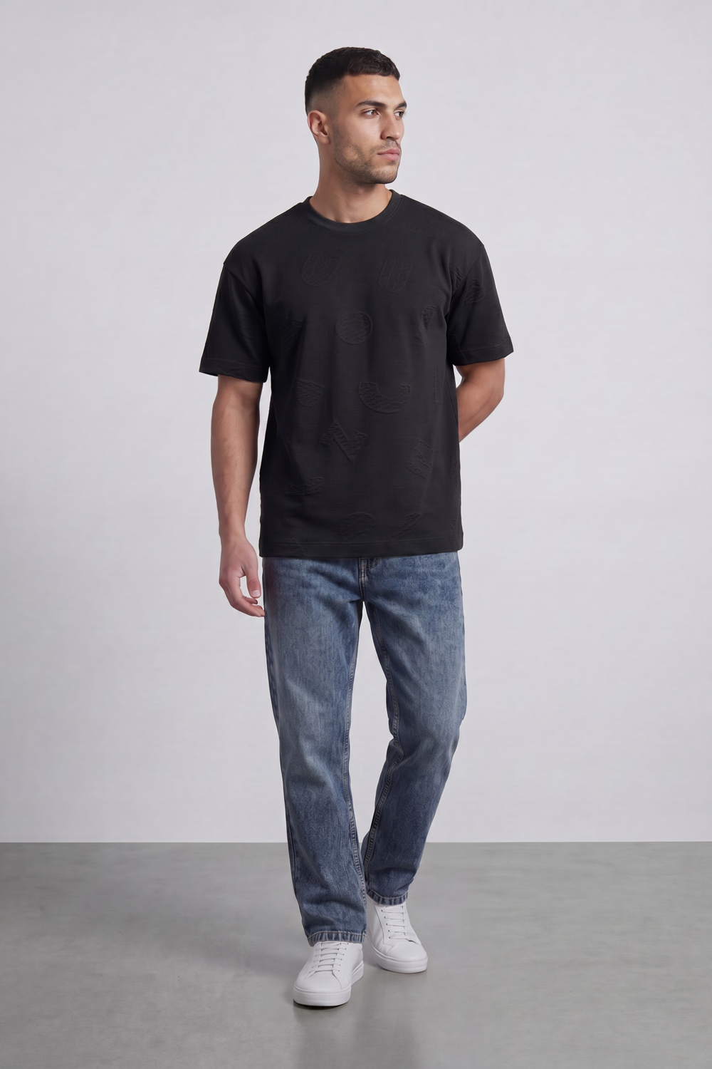 Men’s Tomato Store Ghost Emblem T-Shirt Tonal Raised Symbol Motifs Spread Across A Fine Ripple Surface Relaxed Fit