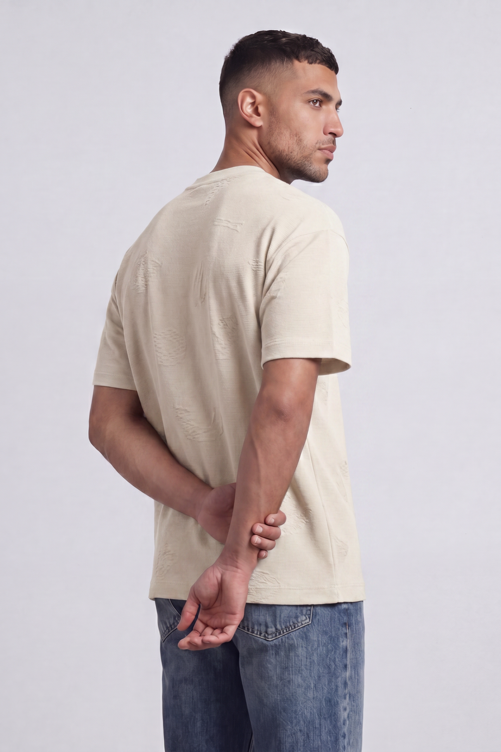 Men’s Tomato Store Ghost Emblem T-Shirt Tonal Raised Symbol Motifs Spread Across A Fine Ripple Surface Relaxed Fit
