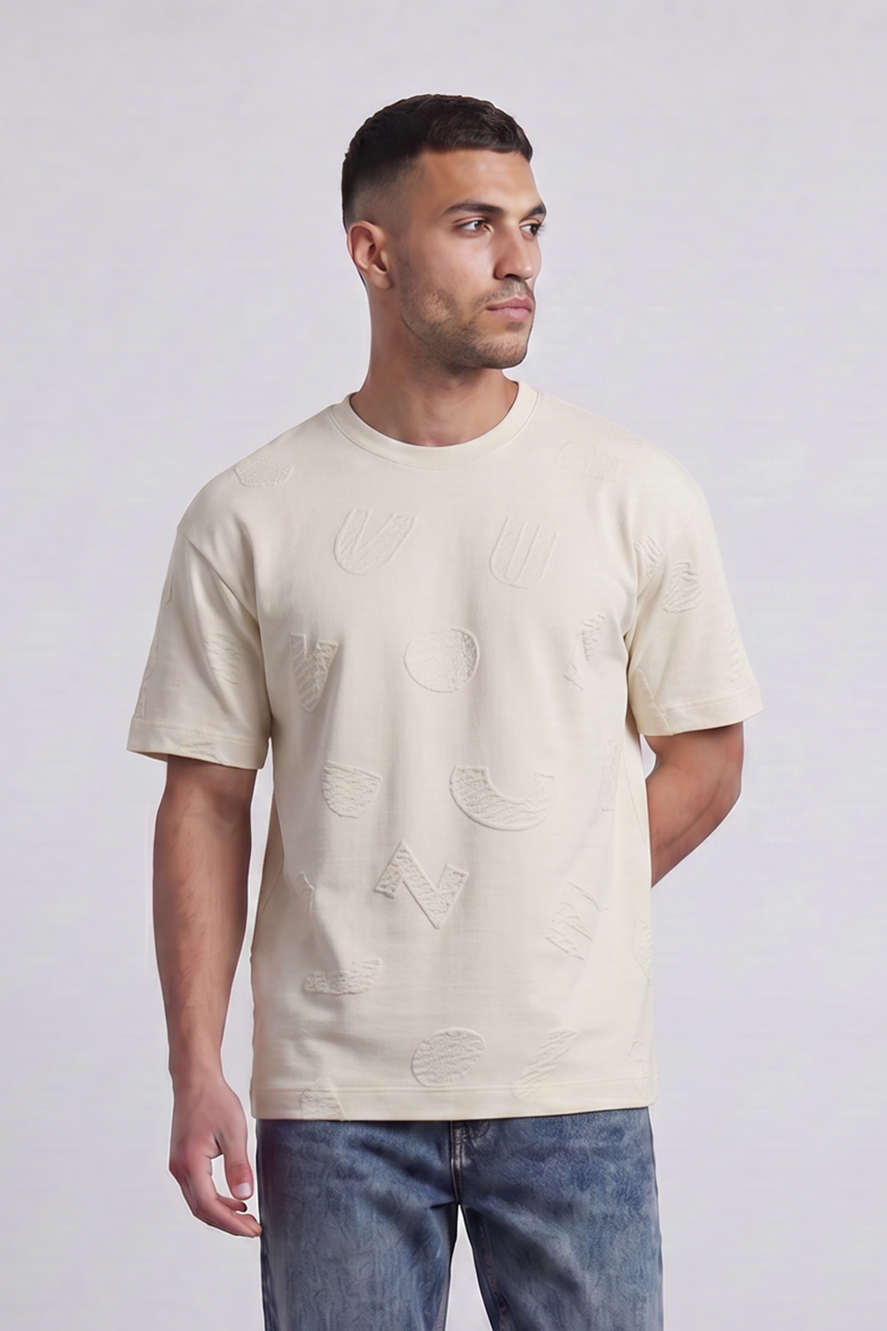 Men’s Tomato Store Ghost Emblem T-Shirt Tonal Raised Symbol Motifs Spread Across A Fine Ripple Surface Relaxed Fit