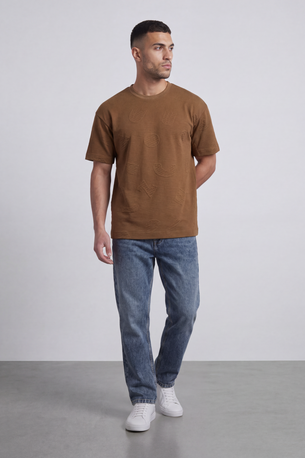Men’s Tomato Store Ghost Emblem T-Shirt Tonal Raised Symbol Motifs Spread Across A Fine Ripple Surface Relaxed Fit