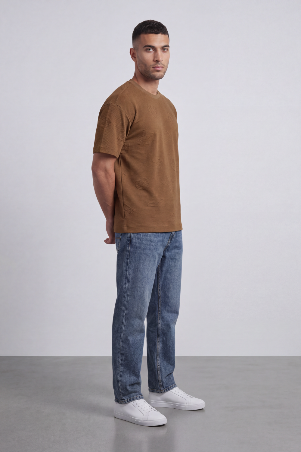 Men’s Tomato Store Ghost Emblem T-Shirt Tonal Raised Symbol Motifs Spread Across A Fine Ripple Surface Relaxed Fit