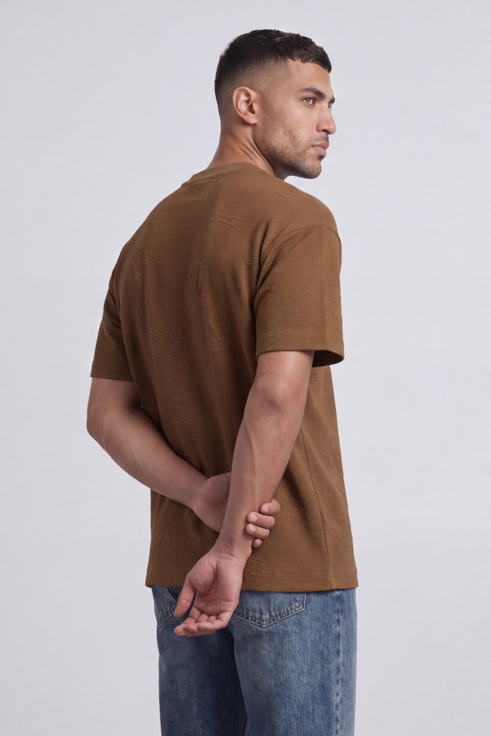 Men’s Tomato Store Ghost Emblem T-Shirt Tonal Raised Symbol Motifs Spread Across A Fine Ripple Surface Relaxed Fit