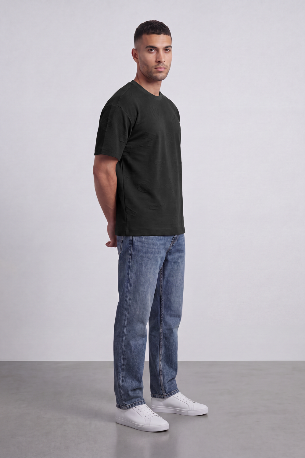 Men’s Tomato Store Ghost Emblem T-Shirt Tonal Raised Symbol Motifs Spread Across A Fine Ripple Surface Relaxed Fit