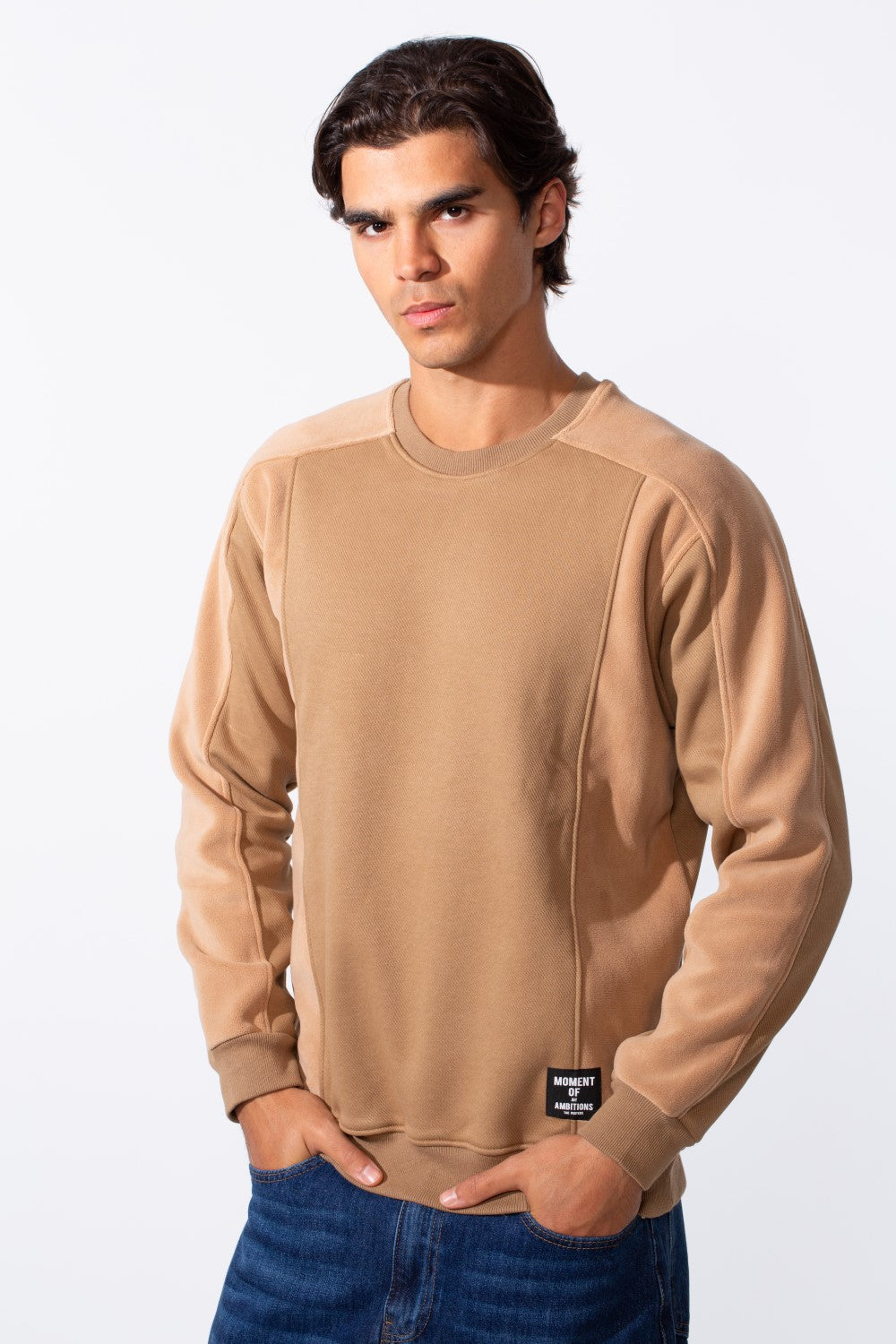 Men's slim fit round neck sweatshirt in tan with contrasting fleece panels and a small hem tag.