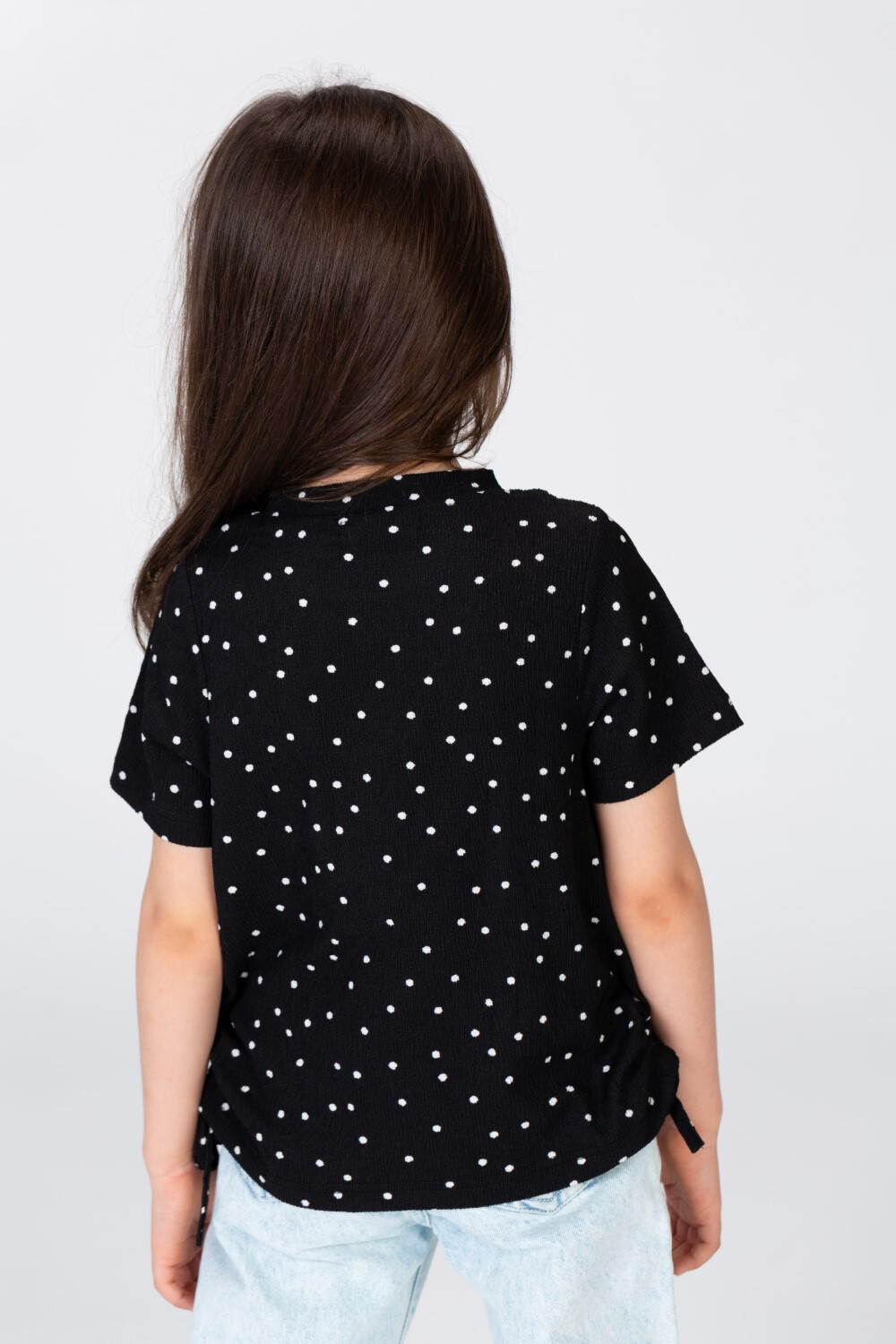 Girls Dotted Blouse With Elastic On The Side And A Necklace Around The Neck