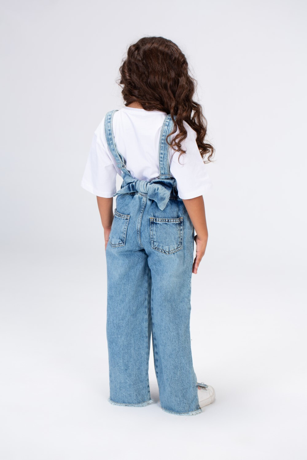 Girls Used Slouchy Jeans Jumpsuit With A Bow Tie At The Back And A Modern Cut
